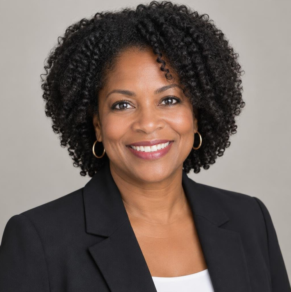 Portrait of a Black woman entrepreneur smiling in business attire